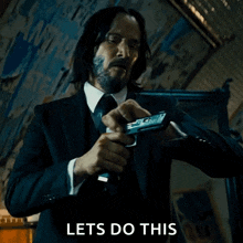 cocking-pistol-john-wick.gif