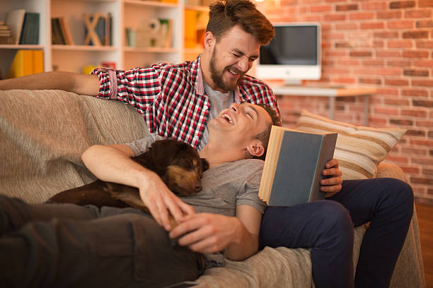 young-gay-couple-at-home-with-their-dog.jpg